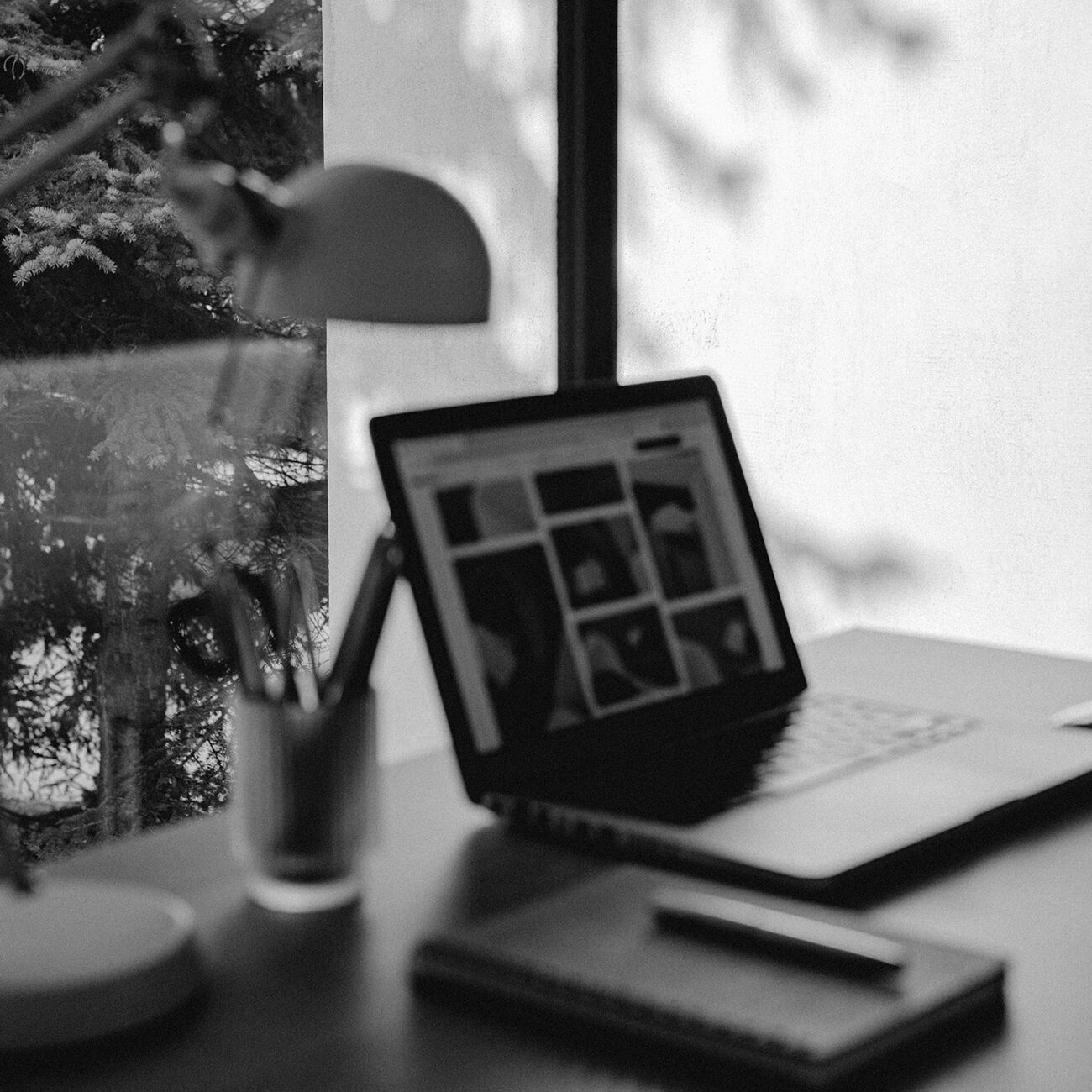 Office desk with lamp, notebook and lamp